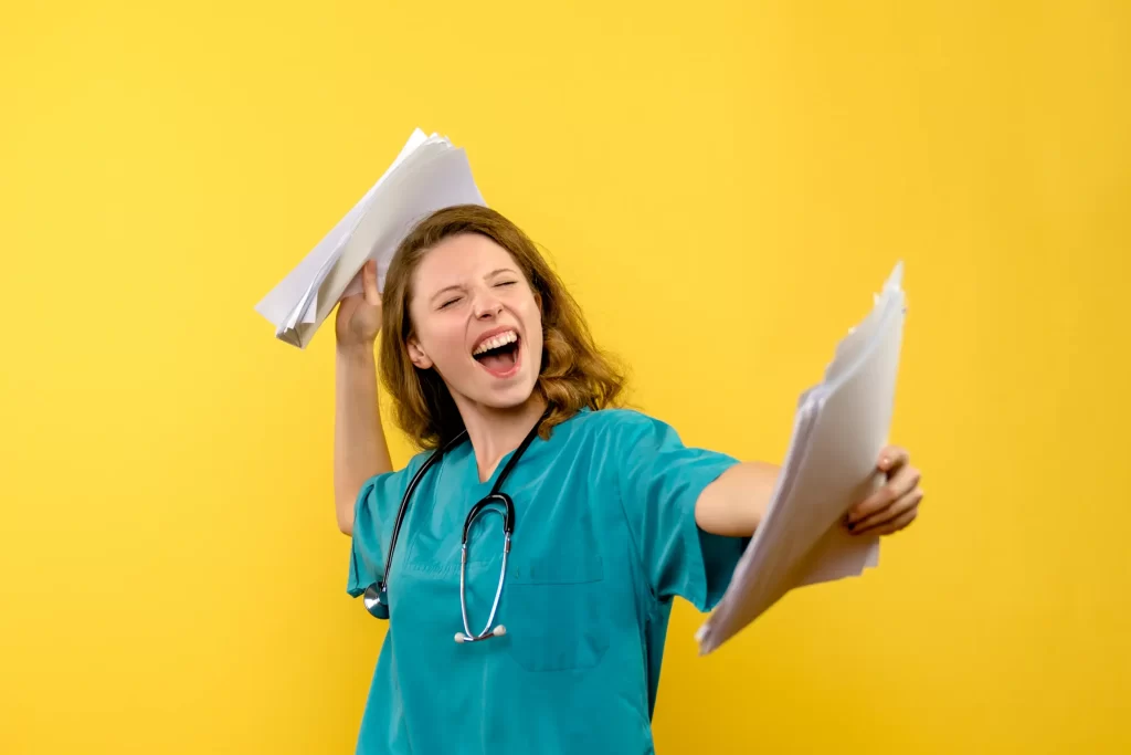 A travel nurse is celebrating with happy face for her nursing qualification