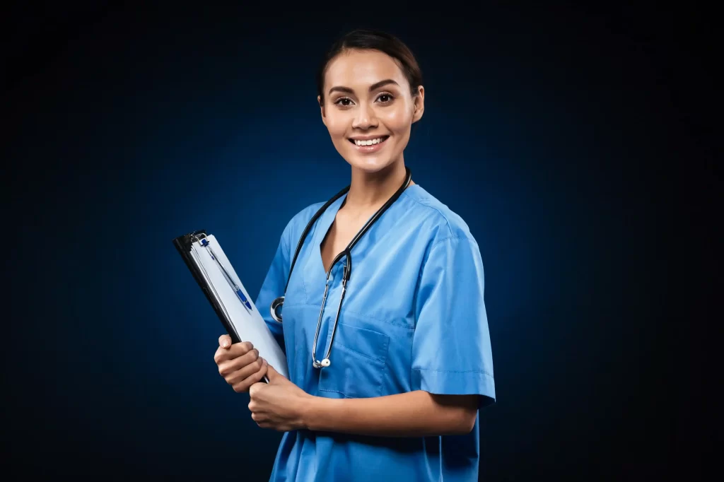 A flight nurse holding a notepad with smiling face 