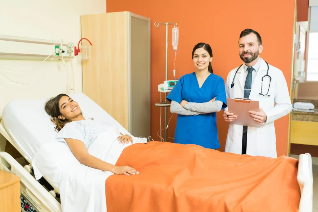 A fertility nurse with a patient and doctor who is managing treatment plans.